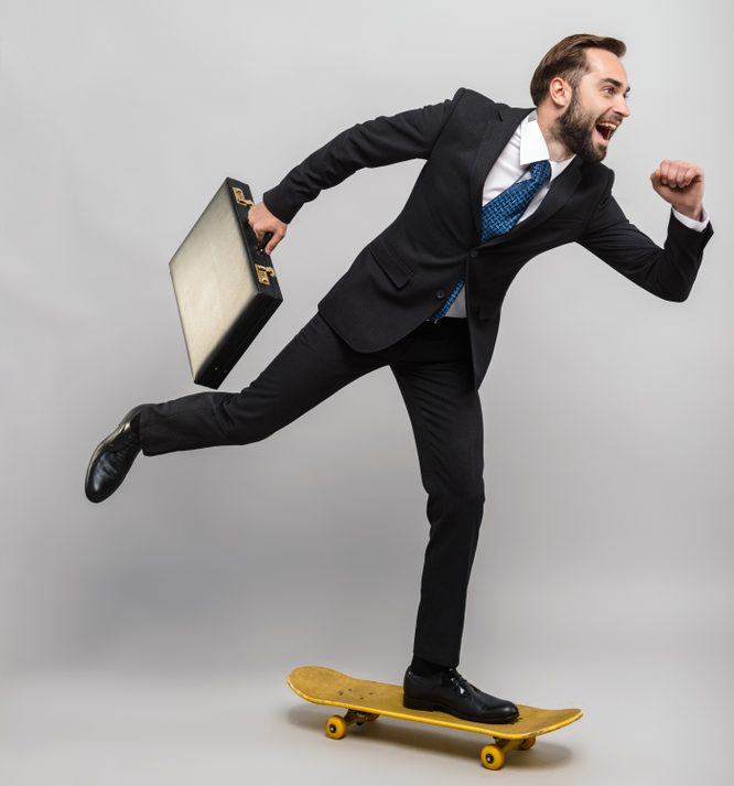 Full,Length,Of,An,Attractive,Smiling,Young,Businessman,Wearing,Suit